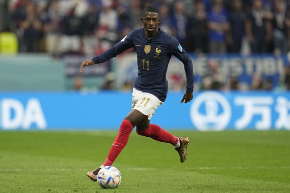 France&#039;s Ousmane Dembele goes with the ball during the World Cup quarterfinal soccer match between England and France, at the Al Bayt Stadium in Al Khor, Qatar, Saturday, Dec. 10, 2022. (AP Photo ...