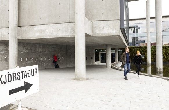 People leave a polling station in Reykjavik, Iceland, Saturday, Sept. 25, 2021. Iceland is heading to the polls for general elections on Saturday with nine parties running for seats at the North Atlan ...