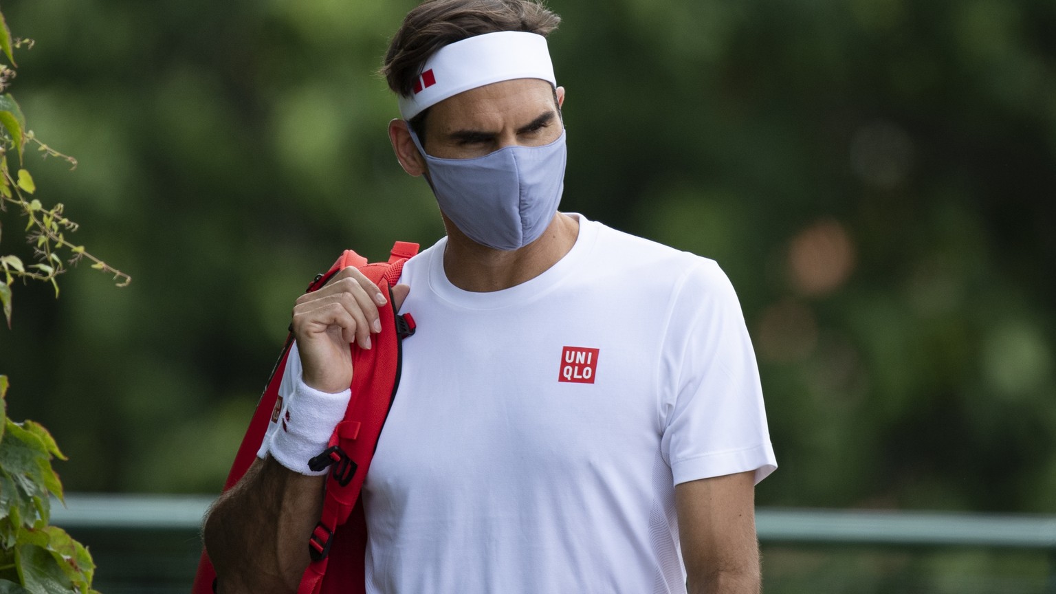 epa09322460 Roger Federer of Switzerland reacts after a training session at the Aorangi Practice Courts at The Wimbledon Championships tennis tournament in Wimbledon, Britain, 04 July 2021. EPA/AELTC  ...