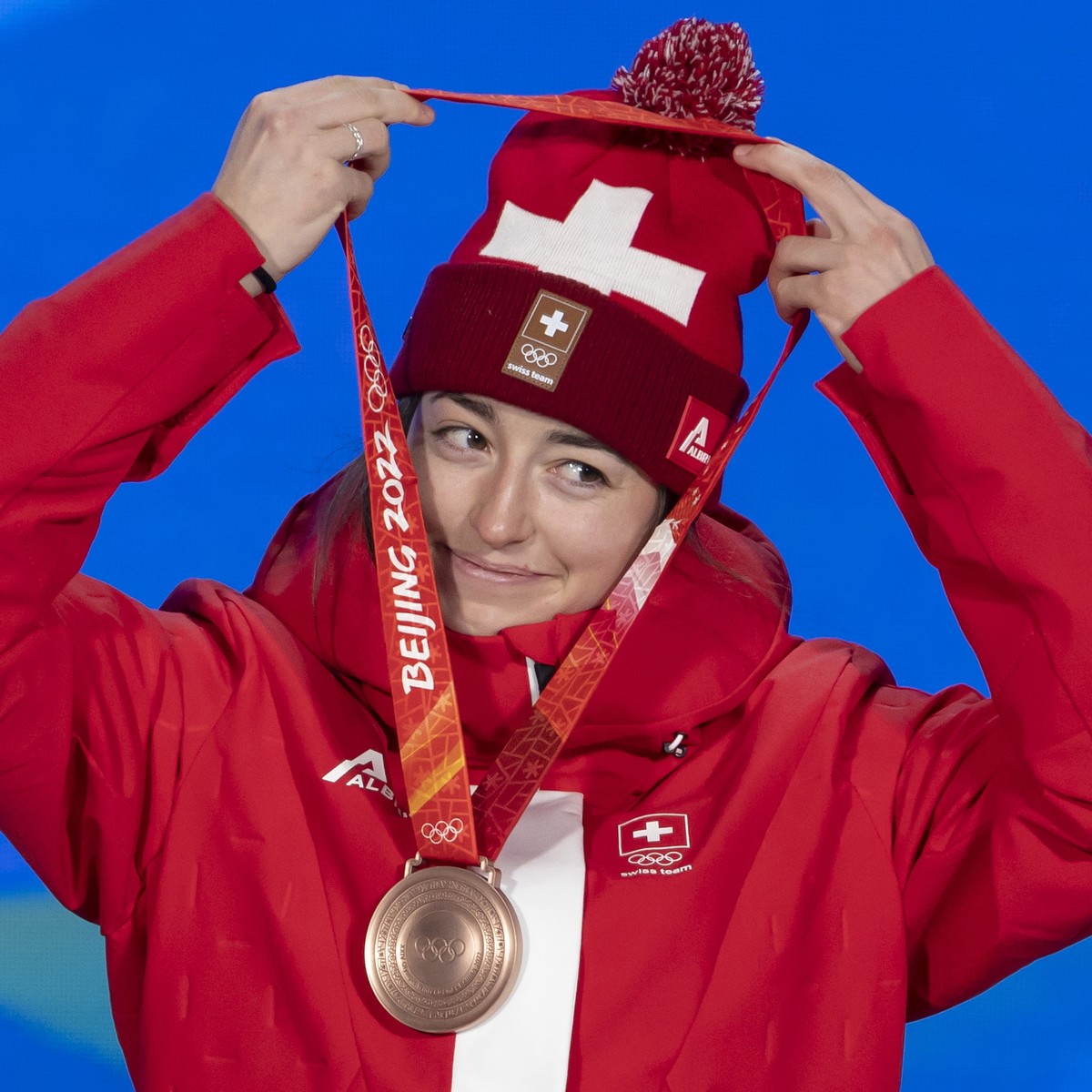 epa09738412 Bronze medalist Mathilde Gremaud of Switzerland celebrates during the medal ceremony for the Women's Freestyle Big Air in Beijing, China, 08 February 2022. EPA/SALVATORE DI NOLFI
