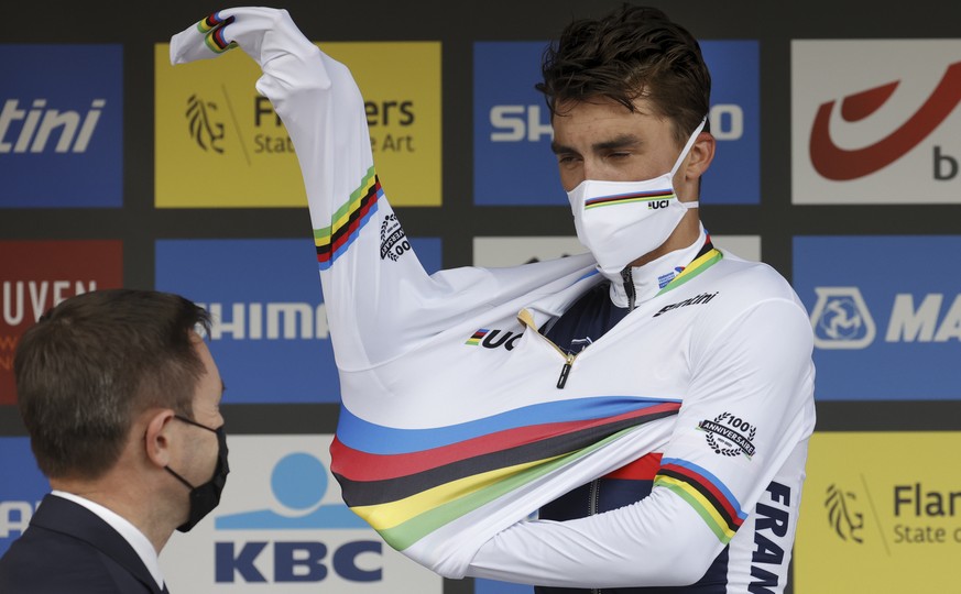 World champion Julian Alaphilippe of France puts the rainbow jersey on after clinching his second consecutive title in the men&#039;s road race of the World Road Cycling Championships in Leuven, Belgi ...