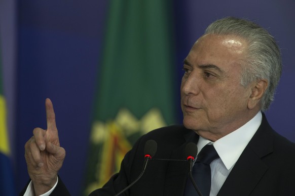 epa06120337 Brazilian President Michel Temer speaks during the signing ceremony of a medicine budget in Brasilia, Brazil, 01 August 2017. The Brazilian Chamber of Deputies took up its session after a  ...