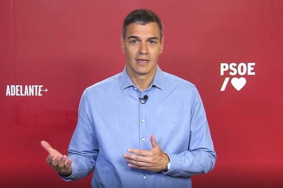 epa10778652 A handout still image taken from a video, made available by the Spanish Socialist Party PSOE via social media shows acting Prime Minister Pedro Sanchez making a statement in an unknown loc ...