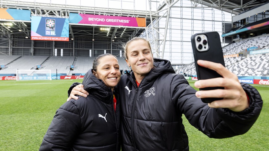 epa10756882 Switzerland&#039;s Fabienne Humm (L) and Ana Maria Crnogorcevic pose for a selfie while inspecting the pitch of the Dunedin Stadium the day before the FIFA Women&#039;s World Cup match aga ...
