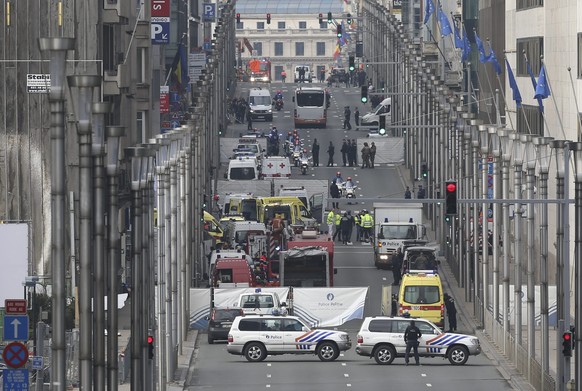 epa05225323 Emergency workers at Rue de la Loi, after an explosion at Maelbeek Metro station, Brussels, Belgium, 22 March 2016. A double explosion in the departure hall of Zaventem Airport in Brussels ...