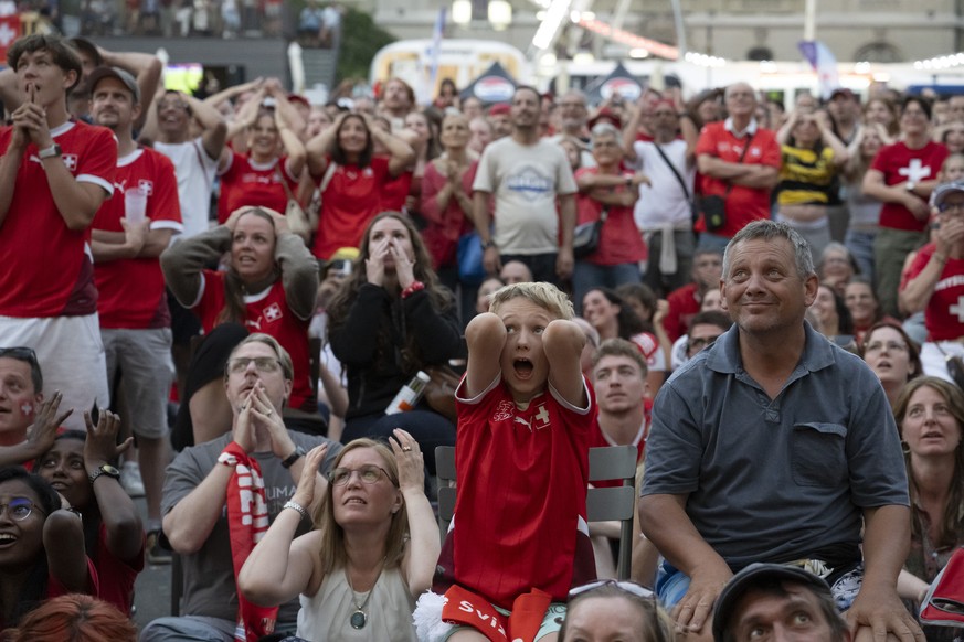 Supporters and Fans from Switzerland reacts at the Fan Zone and public viewing on Bundesplatz Square at the UEFA Women&#039;s EURO 2025 quaterfinal soccer match between Switzerland and Spain in Bern,  ...