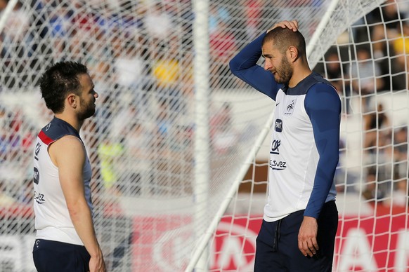 FILE - In this June 10, 2014 file photo, France&#039;s Mathieu Valbuena, left, and Karim Benzema, right, chat during a training session of the french national soccer team, at the Santa Cruz Stadium in ...