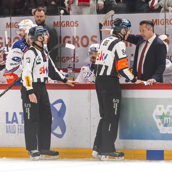 ZSC Lions&#039; Head coach Marco Bayer talks to the Head referee Michael Tscherrig, during the third leg of the National League Swiss Championship final playoff game between Lausanne HC, LHC, and ZSC  ...