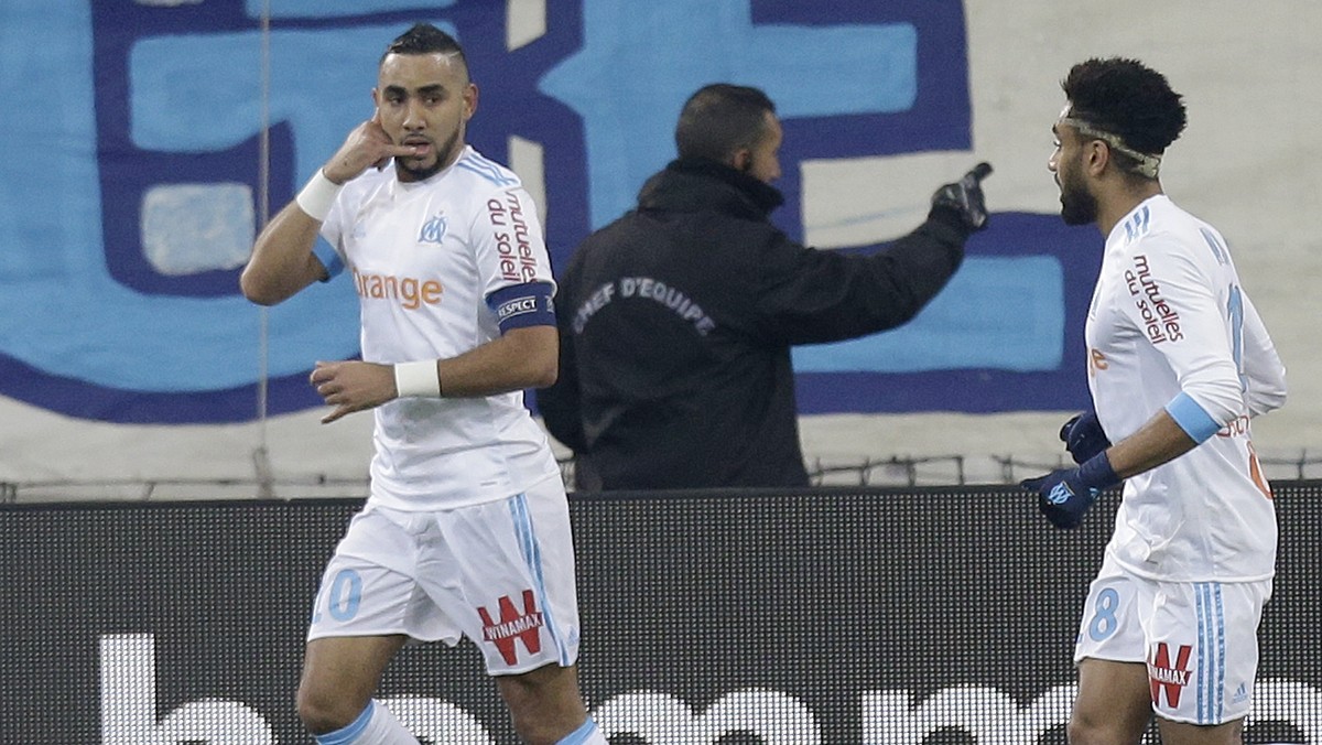 Marseille's Dimitri Payet, left, celebrates with teammate Jordan Amavi after scoring during the League One soccer match between Marseille and Troyes, at the Velodrome stadium, in Marseille, south ...