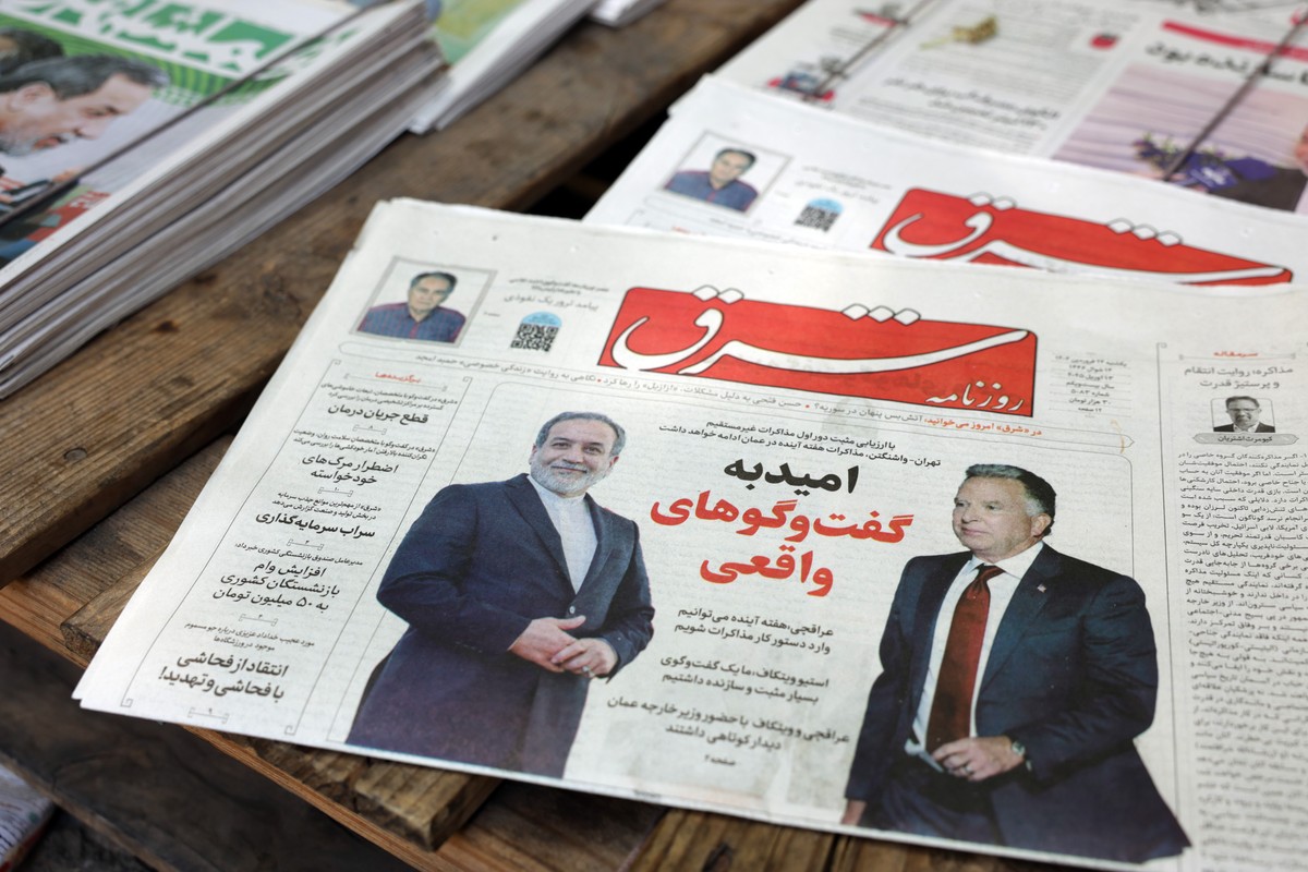 epa12028810 A copy of Iranian daily newspaper Shargh entitled 'Hope for real negotiations' carrying a picture of Iranian Foreign Minister Abbas Araghchi and US Special Envoy to the Middle Ea ...
