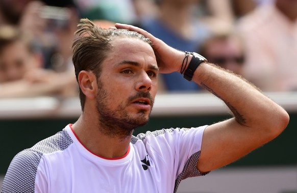 epa07605978 Stan Wawrinka of Switzerland plays Jozef Kovalik of Slovakia during their men’s first round match during the French Open tennis tournament at Roland Garros in Paris, France, 27 May 2019 EP ...