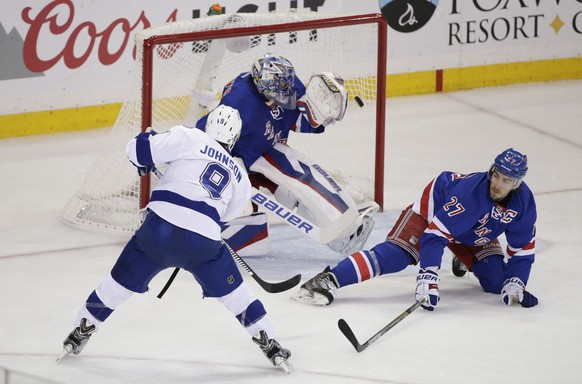 Tampa Bay Lightning center Tyler Johnson (9) shoots to score his second goal of the game against New York Rangers goalie Henrik Lundqvist (30) during the first period of Game 2 of the Eastern Conferen ...