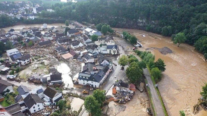 A photo, taken with a drone, shows the devastation caused by the flooding of the Ahr River in the Eifel village of Schuld, western Germany, Thursday, July 15, 2021. At least eight people have died and ...