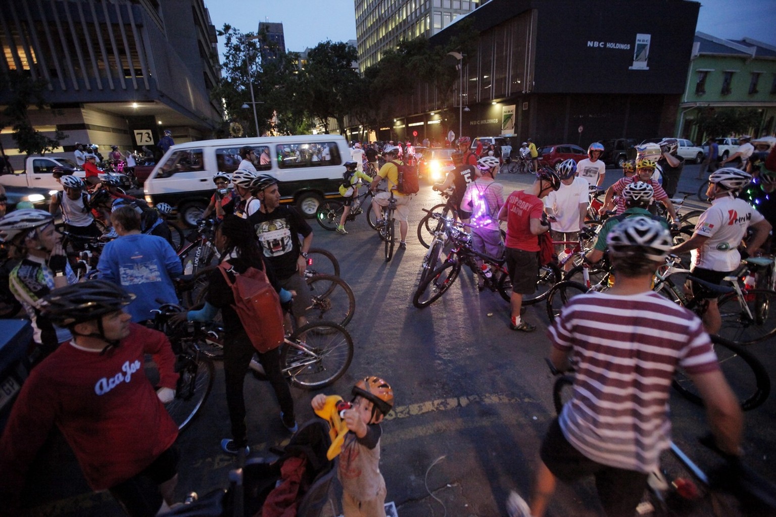 epa03492472 Some of the one thousand cyclists prepare to ride in the monthly Critical Mass bicycle ride , Johannesburg, South Africa, 30 November 2012. The mass ride through the streets of downtown Jo ...