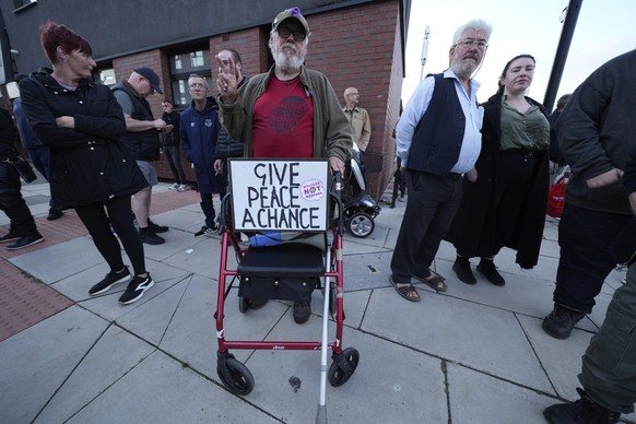 Counter protestors gather in Liverpool, Wednesday, Aug. 7, 2024 ahead of anti-immigration groups planning to target dozens of locations throughout the country following a week of rioting fueled by mis ...