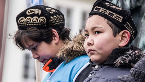 February 2, 2019 - Munich, Bavaria, Germany - Uyghur children in Germany protesting with the flag of East Turkestan, which is also known as the Xinjiang Autonomous Province. Over 400 primarily Turkish ...