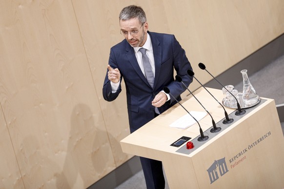 epa07605621 Former Austrian Interior minister Herbert Kickl of the right-wing Austrian Freedom Party (FPOe) delivers a speech during a special session of the parliament at the temporary parliament bui ...