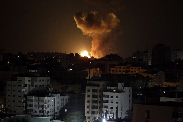 epa10605354 Smoke rises after Israeli air strike in the northern Gaza strip, in Gaza City, early 03 May 2023. The airstrikes come after militant groups in Gaza claimed responsibility for firing dozens ...