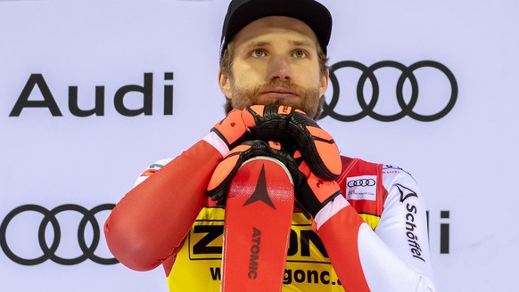epa11041535 Winner Marco Schwarz of Austria celebrates on the podium for the Men&#039;s Slalom race at the FIS Alpine Skiing World Cup in Madonna di Campiglio, Italy, 22 December 2023. EPA/ANDREA SOLE ...