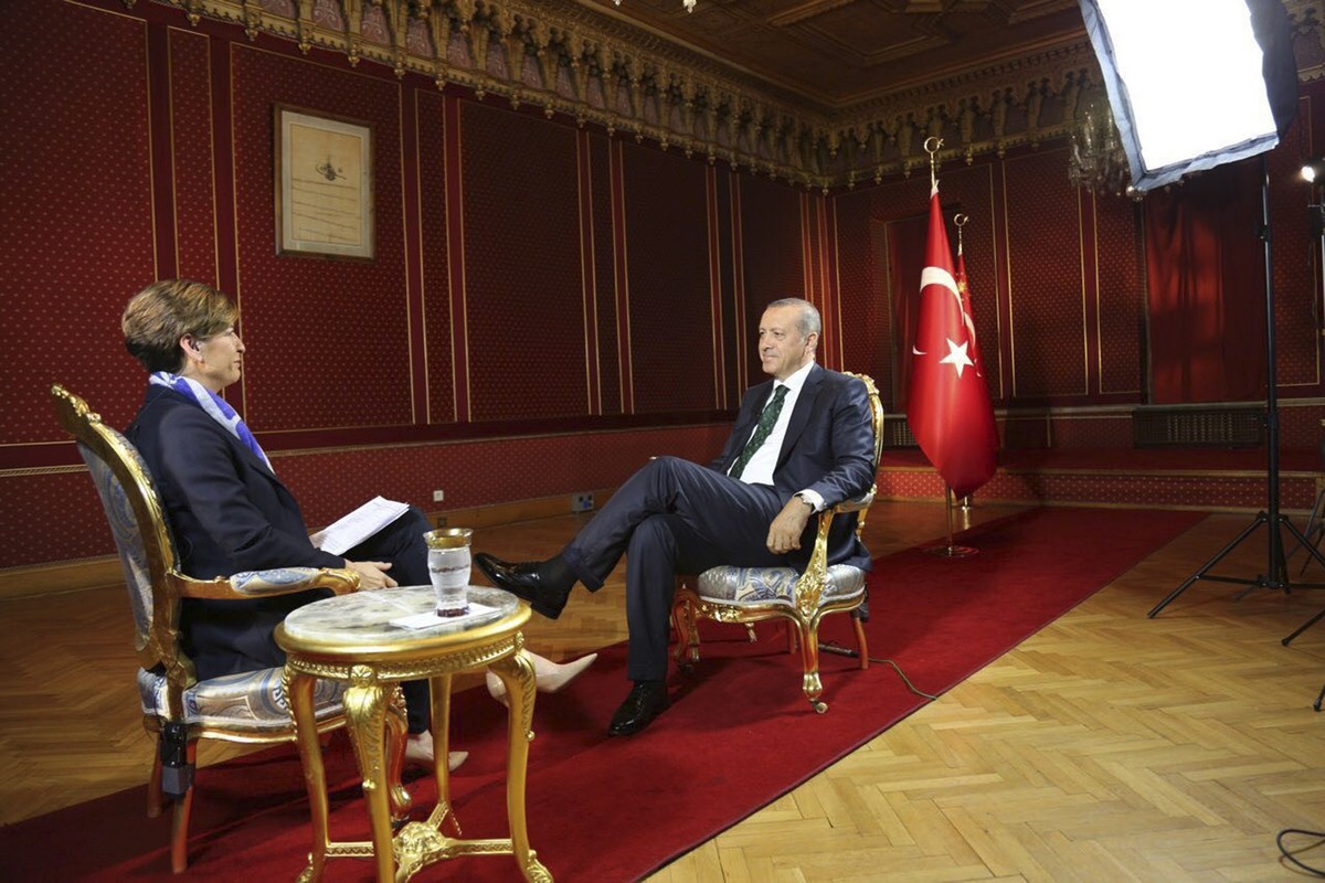 In this photo released and broadcast by CNN Monday, July 18, 2016, Turkey's President Recep Tayyip Erdogan, right, is interviewed by CNN's Becky Anderson, about the failed military coup on J ...
