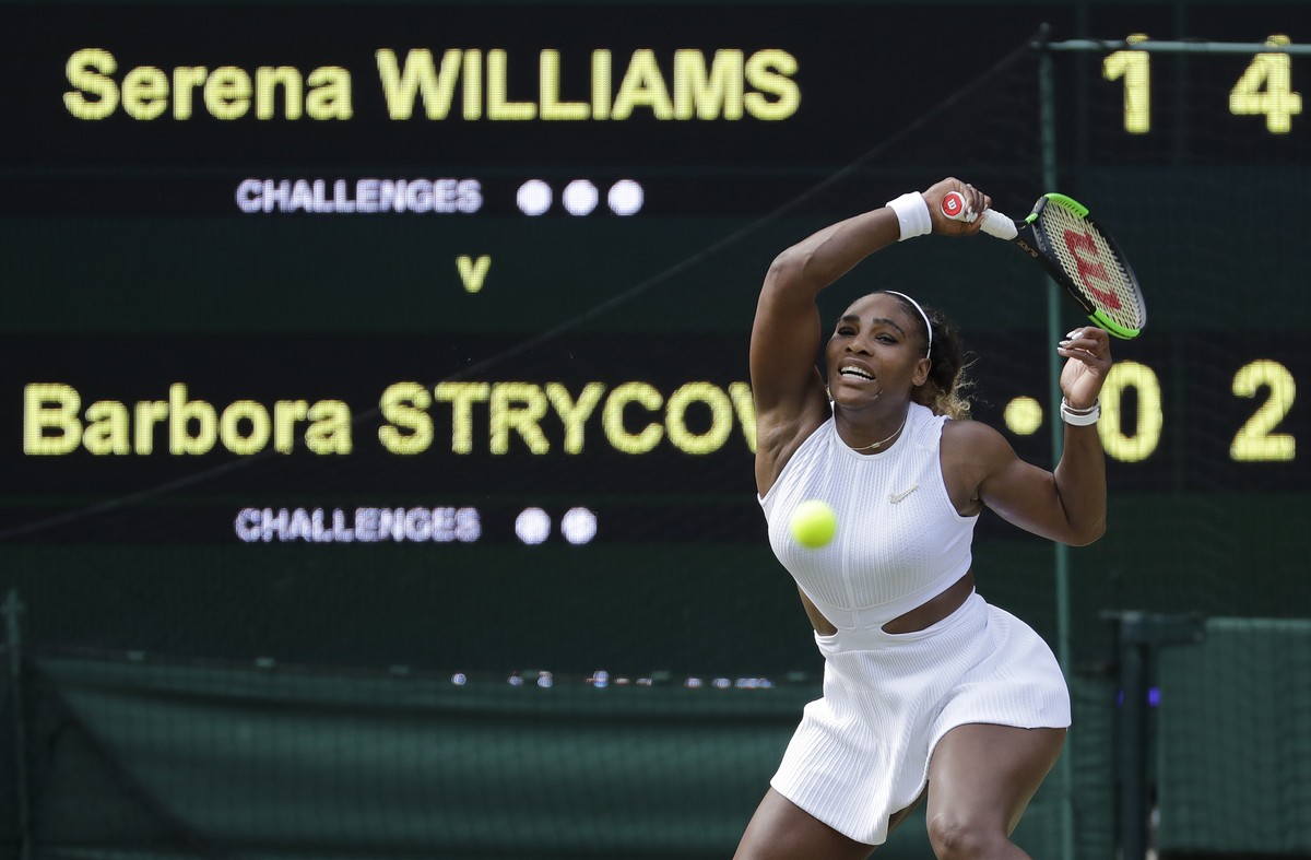 United States' Serena Williams returns to Czech Republic's Barbora Strycova in a Women's semifinal singles match on day ten of the Wimbledon Tennis Championships in London, Thursday, Ju ...