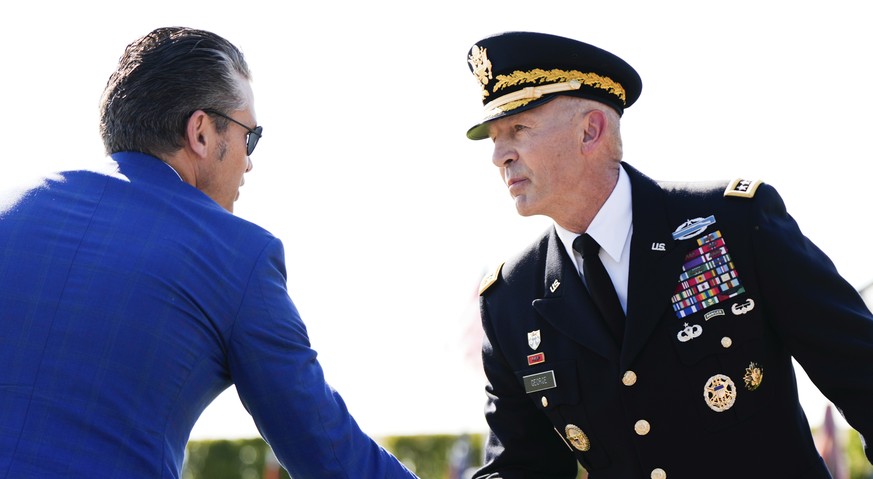 Defense Secretary Pete Hegseth, left, and Army Chief of Staff Gen. Randy George shake hands during the POW/MIA National Recognition Day Ceremony at the Pentagon, Friday, Sept. 19, 2025, in Washington. ...