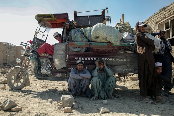 epa12818966 People gather near the damaged houses following alleged Pakistani airstrikes in Kabul, Afghanistan, 14 March 2026. Pakistani strikes on Kabul and other parts of Afghanistan killed at least ...