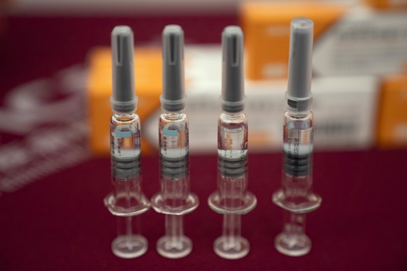 In this Sept. 24, 2020, file photo, syringes of SARS CoV-2 Vaccine for COVID-19 produced by Sinovac are displayed during a media tour of its factory in Beijing. China is rapidly increasing the number  ...