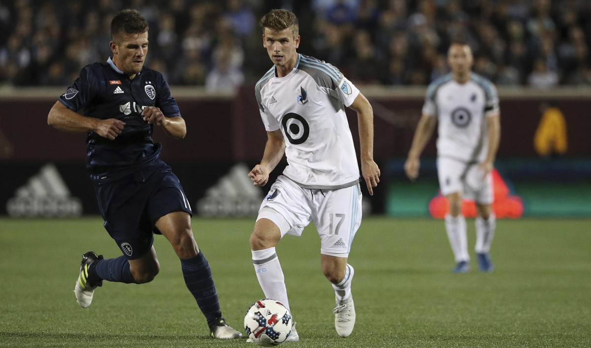 In this Oct. 7, 2017 photo, Minnesota United midfielder Collin Martin (17) controls the ball as Sporting Kansas City forward Diego Rubio (11) chases during the first half of an MLS soccer game at TCF  ...