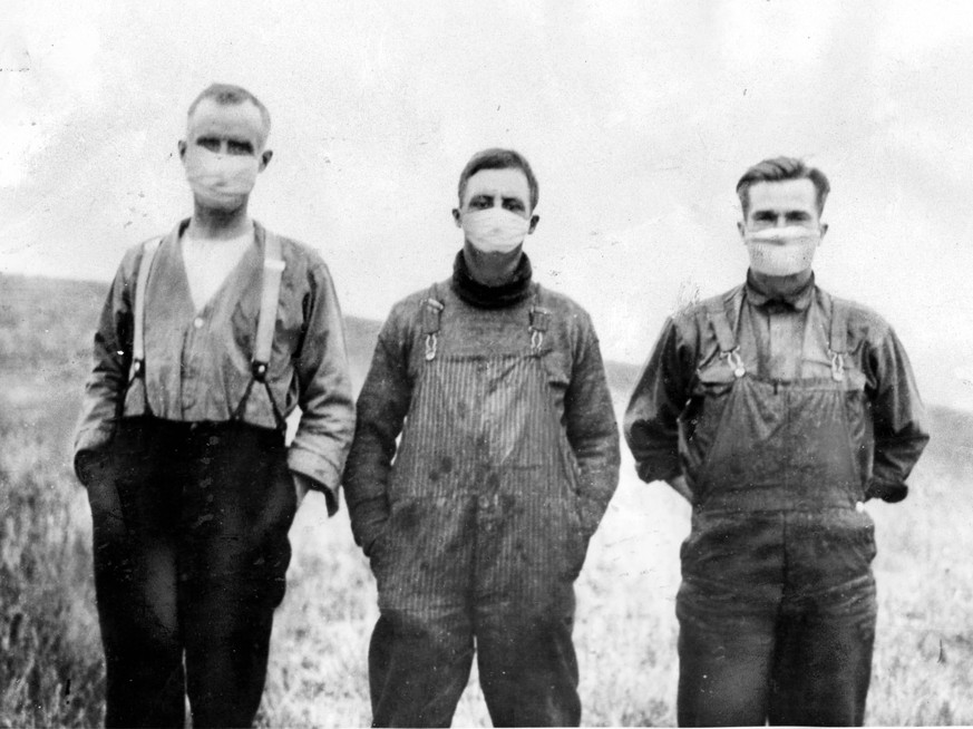 1918 - Toronto, Ontario, Canada - Alberta farmers in 1918 donned gauze masks to evade the Spanish flu contagion rapidly sweeping west after World War I. The modern plague, an astonishingly virulent va ...