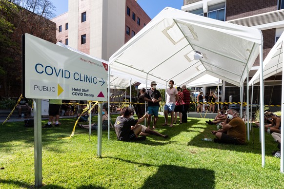 epa08976770 People wait to be tested for Covid-19 at the Covid Clinic in Royal Perth Hospital in Perth, Australia, 31 January 2021. West Australian Premier Mark McGowan has announced a five-day lockdo ...