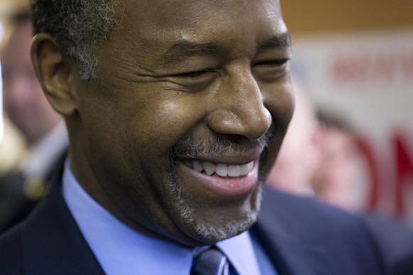Republican presidential candidate, Dr. Ben Carson meets with attendees during a visit to a campaign office Saturday, Feb. 6, 2016, in Manchester, N.H. (AP Photo/Matt Rourke)