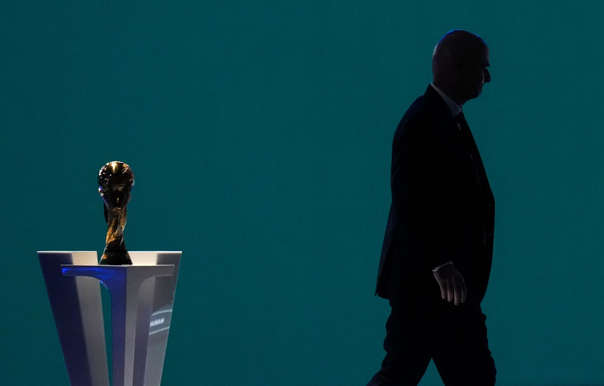 FILE - FIFA President Gianni Infantino is silhouetted as he walks past the World Cup trophy after addressing the 76th FIFA Congress in Vancouver, British Columbia, Thursday, April 30, 2026. (Darryl Dy ...