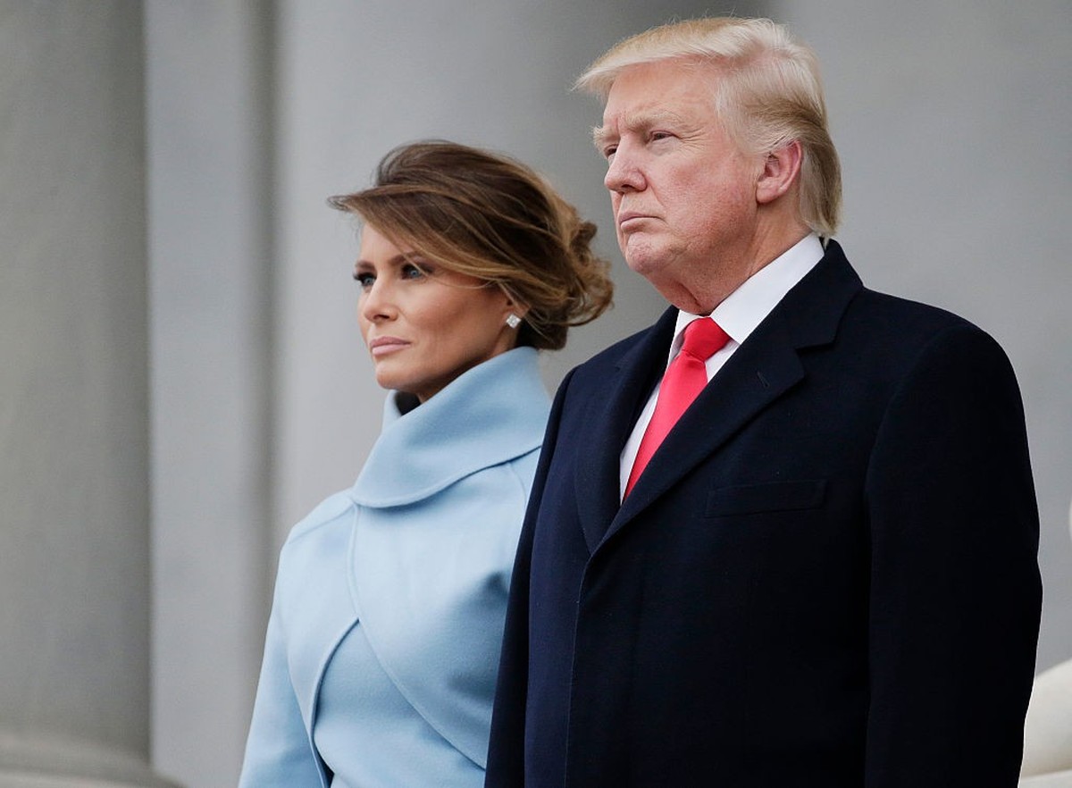WASHINGTON, DC - JANUARY 20: United States President Donald Trump stands with First Lady Melania Trump back to the Capitol Building before departing for the parade after Trump is sworn in at the 58th  ...