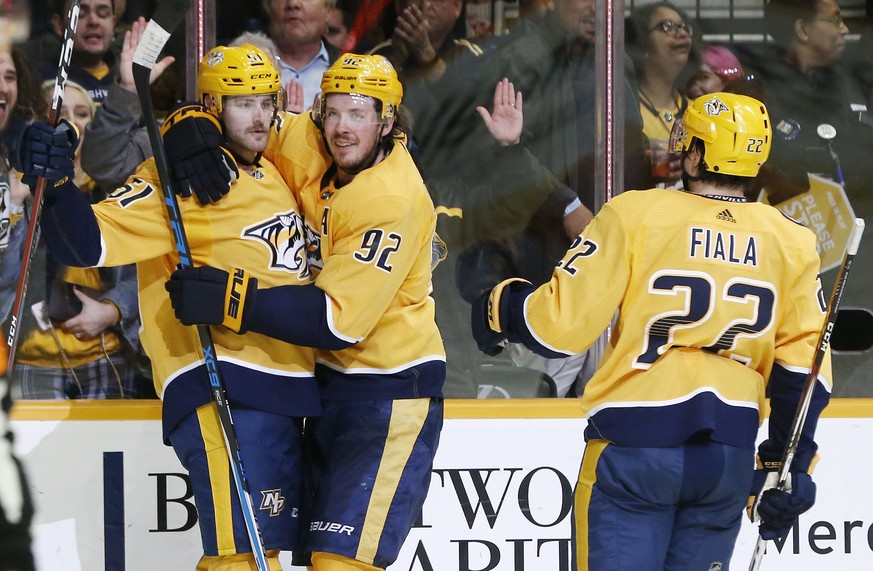 Nashville Predators left wing Austin Watson (51) celebrates with Ryan Johansen (92) and Kevin Fiala (22), of Switzerland, after scoring against the Anaheim Ducks during the second period of an NHL hoc ...