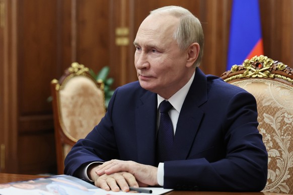 Russian President Vladimir Putin listens to Governor of the Yamal-Nenets Autonomous Area Dmitry Artyukhov during their meeting at the Kremlin, on Tuesday, Oct. 28, 2025. (Alexander Kazakov, Sputnik, K ...