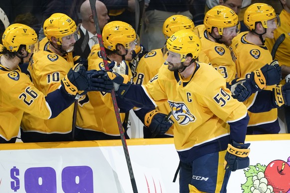 Nashville Predators&#039; Roman Josi (59) is congratulated after scoring a goal against the Dallas Stars in the third period of an NHL hockey game Tuesday, March 8, 2022, in Nashville, Tenn. (AP Photo ...