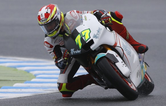 Moto2 rider Dominique Aegerter of Switzerland steers his Suter during a free practice session for the MotoGP Japanese Motorcycle Grand Prix at the Twin Ring Motegi circuit in Motegi, north of Tokyo, S ...