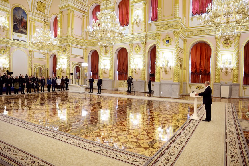 Russian President Vladimir Putin delivers a speech as he attends a ceremony to receive credentials from newly appointed foreign ambassadors to Russia, at the Kremlin, in Moscow, Russia, Wednesday, Apr ...