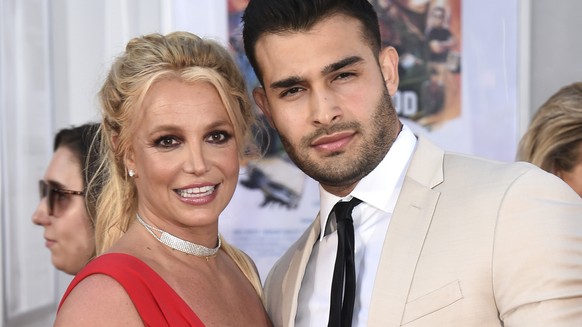 FILE - Britney Spears and Sam Asghari appear at the Los Angeles premiere of &quot;Once Upon a Time in Hollywood&quot; on July 22, 2019. Asghari has filed for divorce from Spears, a person familiar wit ...