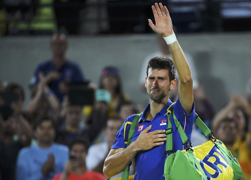 2016 Rio Olympics - Tennis - Preliminary - Men&#039;s Singles First Round - Olympic Tennis Centre - Rio de Janeiro, Brazil - 07/08/2016. Novak Djokovic (SRB) of Serbia reacts after losing his match ag ...