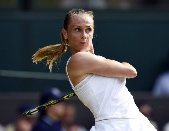 epa06070550 Magdalena Rybarikova of Slovakia returns to Karolina Pliskova of the Czech Republic in their second round match during the Wimbledon Championships at the All England Lawn Tennis Club, in L ...