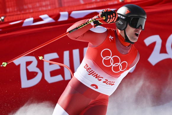 epa09734379 Matthias Mayer of Austria reacts after his run in the Men&#039;s Downhill race of the Alpine Skiing events of the Beijing 2022 Olympic Games at the Yanqing National Alpine Ski Centre Skiin ...