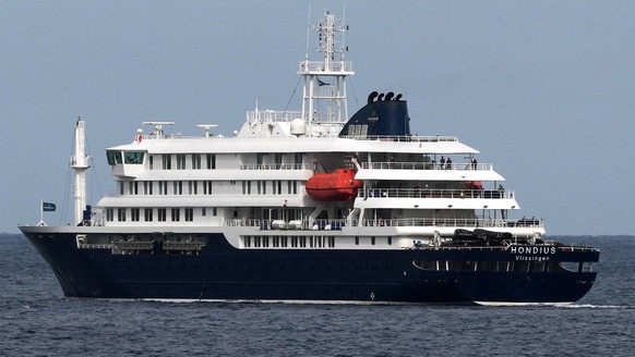 The MV Hondius cruise ship departs the port in Praia, Cape Verde, Wednesday, May 6, 2026. (AP Photo/Misper Apawu)
Cape Verde Hantavirus Ship