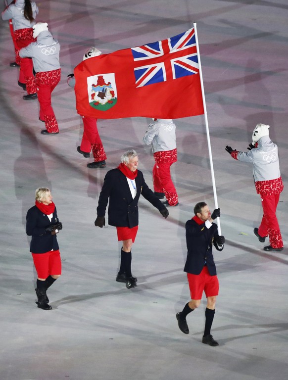 Tucker Murphy carries the flag of Bermuda during the opening ceremony of the 2018 Winter Olympics in Pyeongchang, South Korea, Friday, Feb. 9, 2018. (AP Photo/Matthias Schrader)