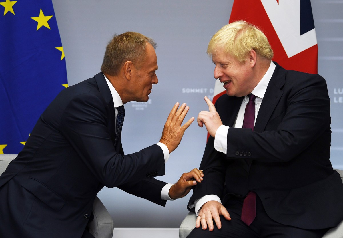 epaselect epa07792318 Britain's Prime Minister Boris Johnson (R) meets European Union Council President Donald Tusk (L) for their bilateral talks during the G7 summit in Biarritz, France, 25 Augu ...