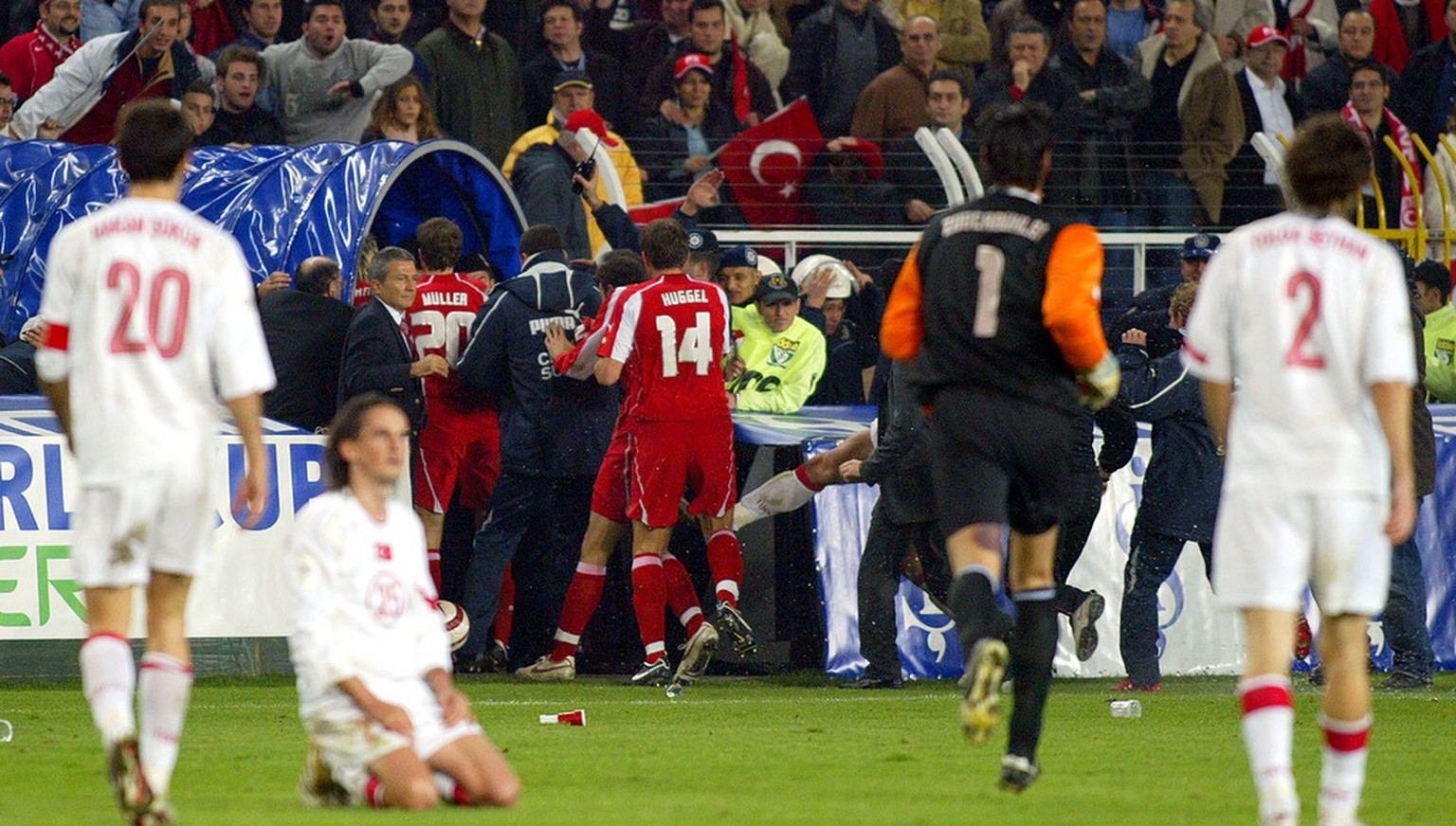 Swiss players, center, leave the field at Sukru Saracoglu Stadium in Istanbul, Turkey, Wednesday, Nov. 16, 2005, at the end of the 2006 World Cup play-off second leg soccer match between Turkey and Sw ...