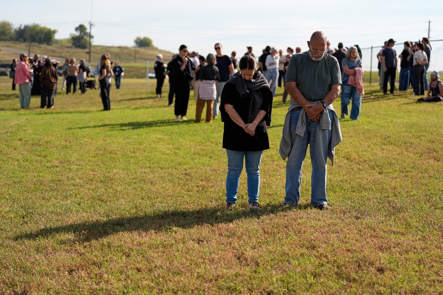 Demonstrators stand in the area reserved for people opposed to the death penalty outside Riverbend Maximum Security Institution before the planned execution of Christa Pike, Wednesday, Sept. 30, 2026, ...