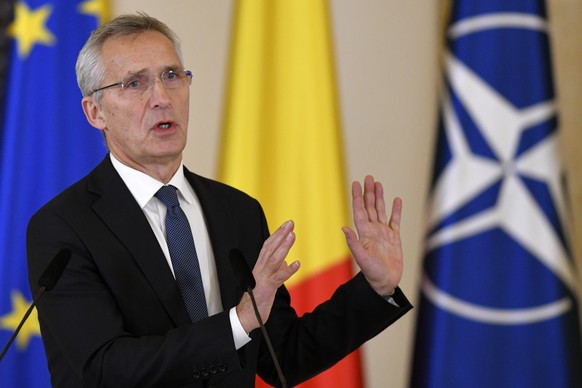 NATO Secretary-General Jens Stoltenberg gestures during joint statements with Romanian President Klaus Iohannis in Bucharest, Romania, Monday, Nov. 28, 2022, a day before the start of the meeting of N ...