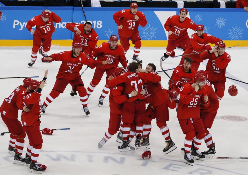 epa06563357 Team Olympic Athletes of Russia (OAR) celebrate with Kirill Kaprizov of Olympic Athletes of Russia (OAR) (C, number 77) after he scored the winning goal at the end of the Men's Ice Hockey  ...